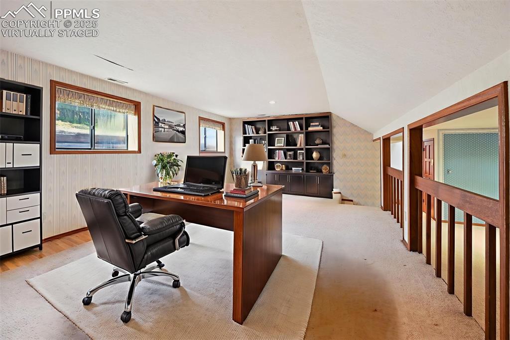 635 Royal Oak Drive Colorado Springs, CO 80906 - Photo 29 of 47 a livingroom with workspace and a couch