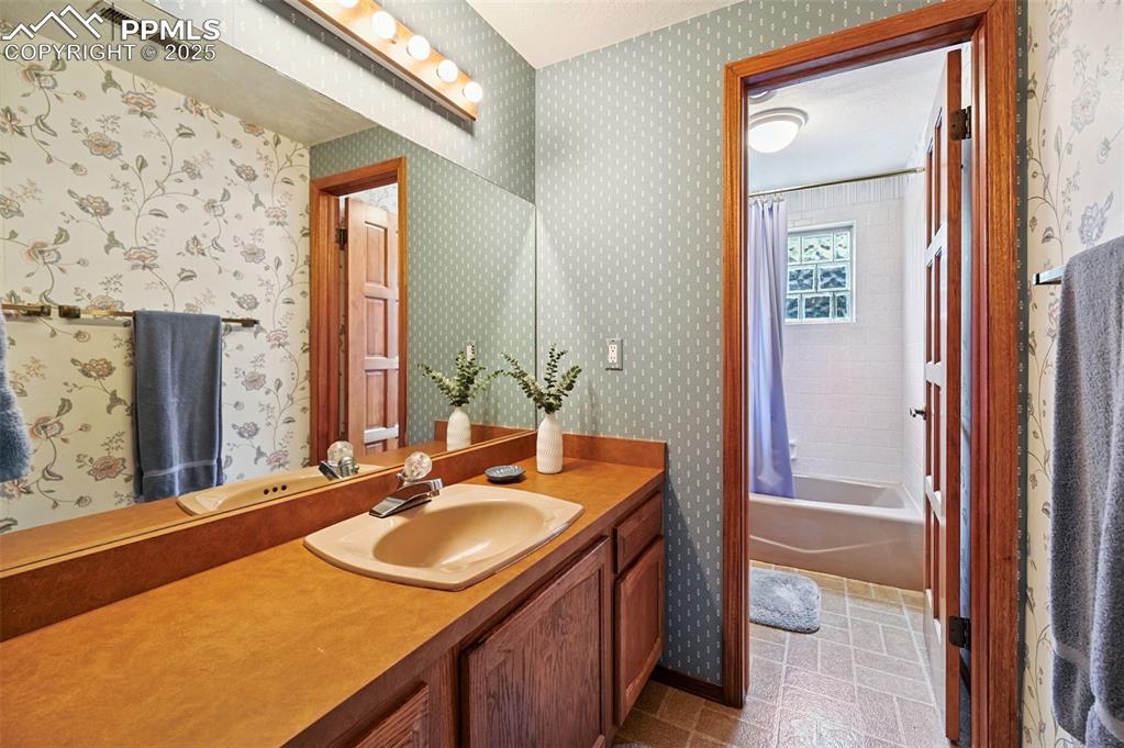 635 Royal Oak Drive Colorado Springs, CO 80906 - Photo 35 of 47 a bathroom with a sink vanity granite and a mirror