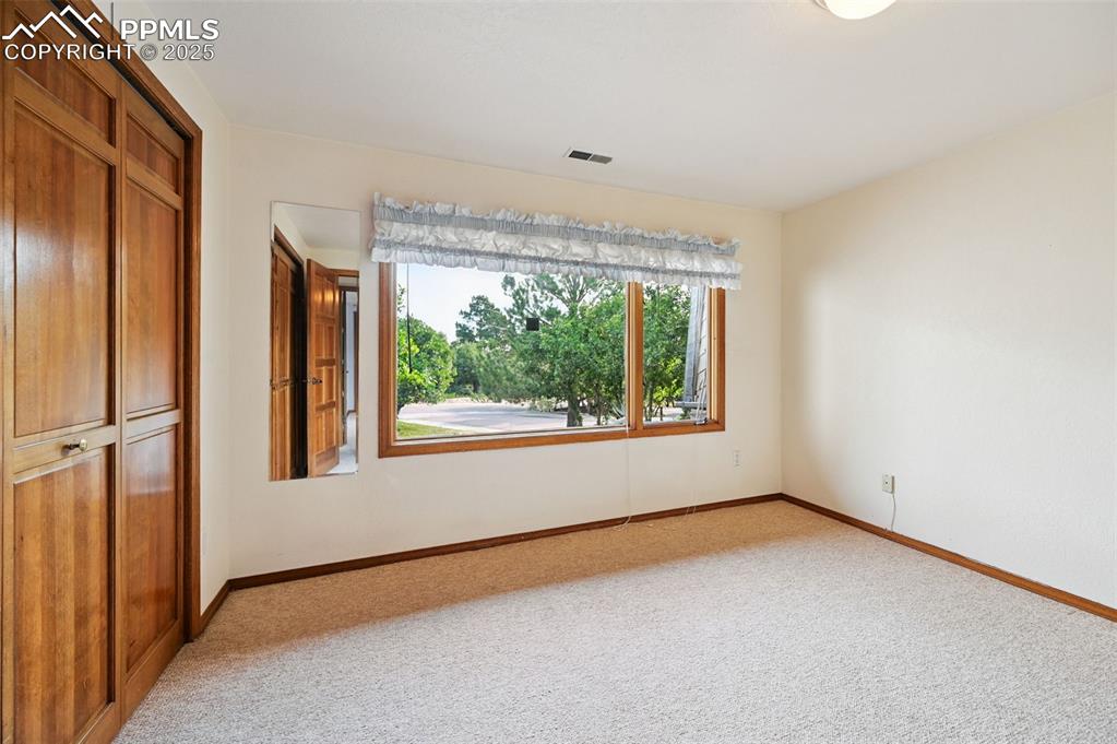 635 Royal Oak Drive Colorado Springs, CO 80906 - Photo 37 of 47 an empty room with a window