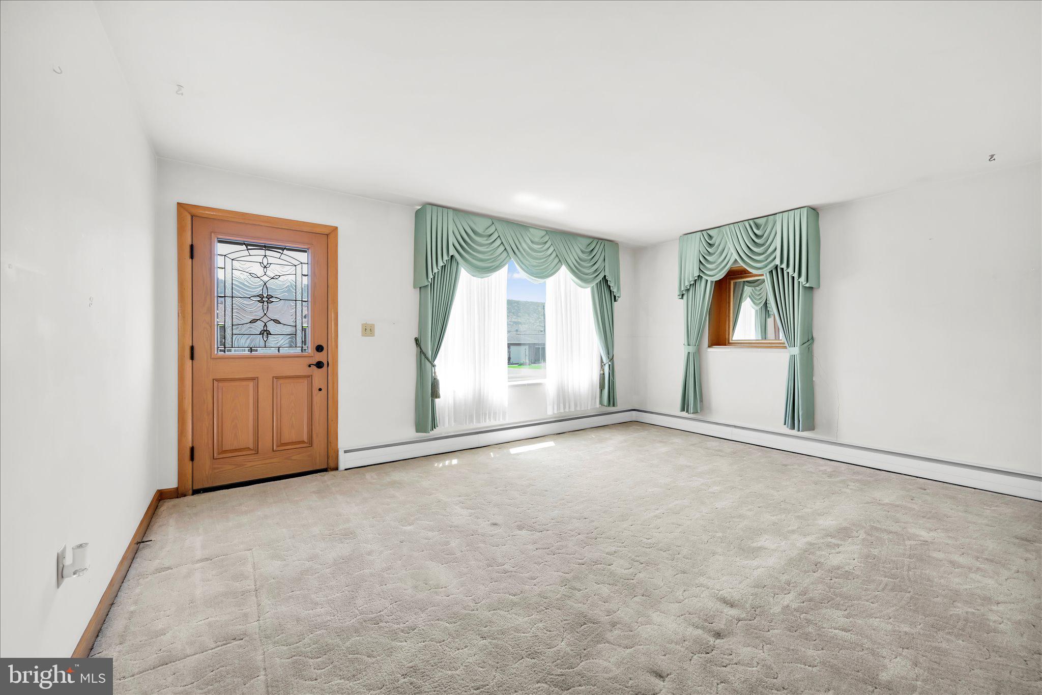 214 West Maple Street Valley View, PA 17983 - Photo 11 of 36 an empty room with windows and closet