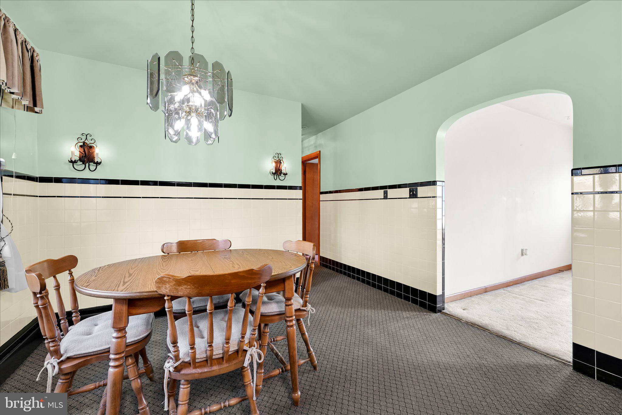 214 West Maple Street Valley View, PA 17983 - Photo 13 of 36 a view of a dining room with furniture and a chandelier