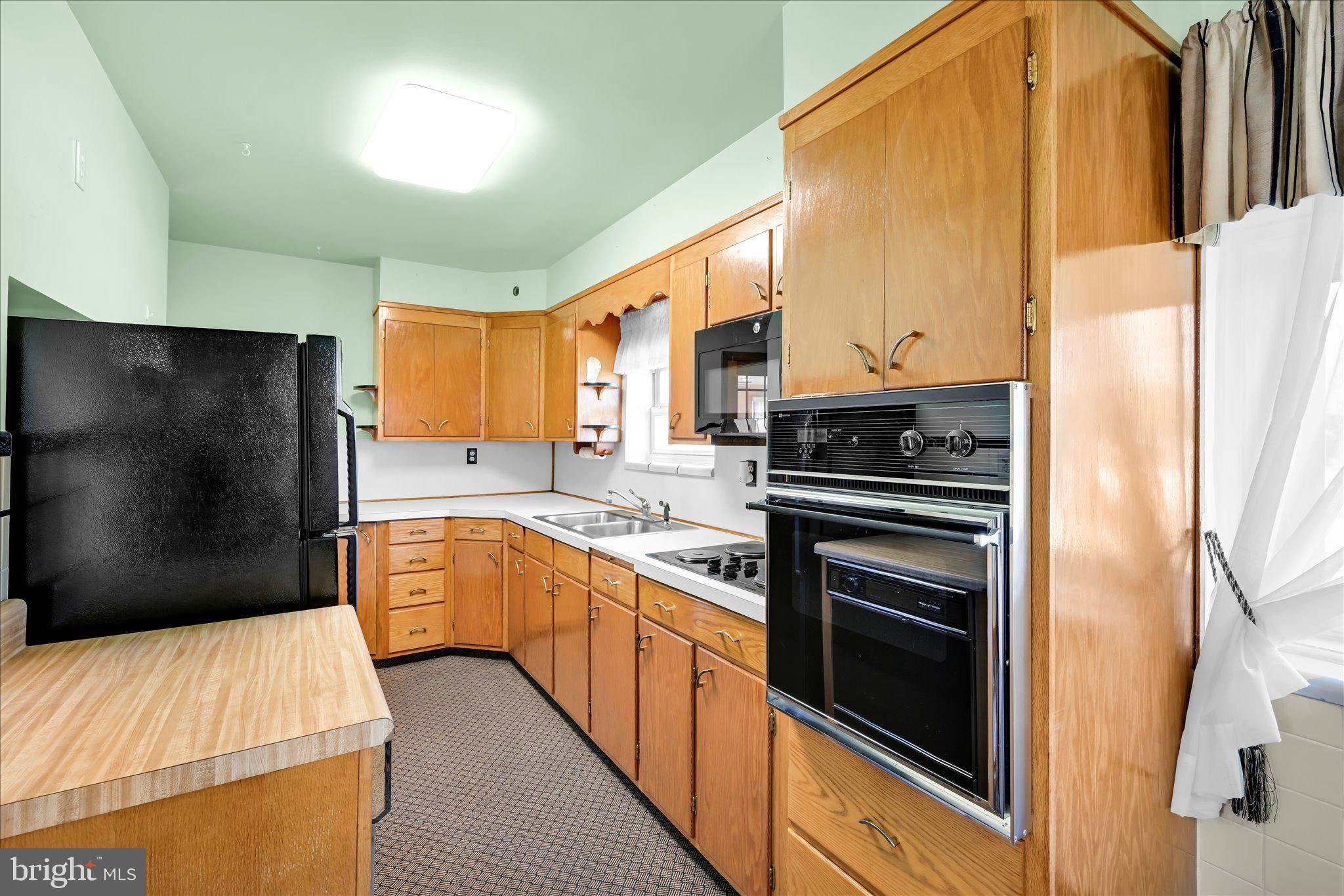 214 West Maple Street Valley View, PA 17983 - Photo 16 of 36 a kitchen with stainless steel appliances a refrigerator sink and stove