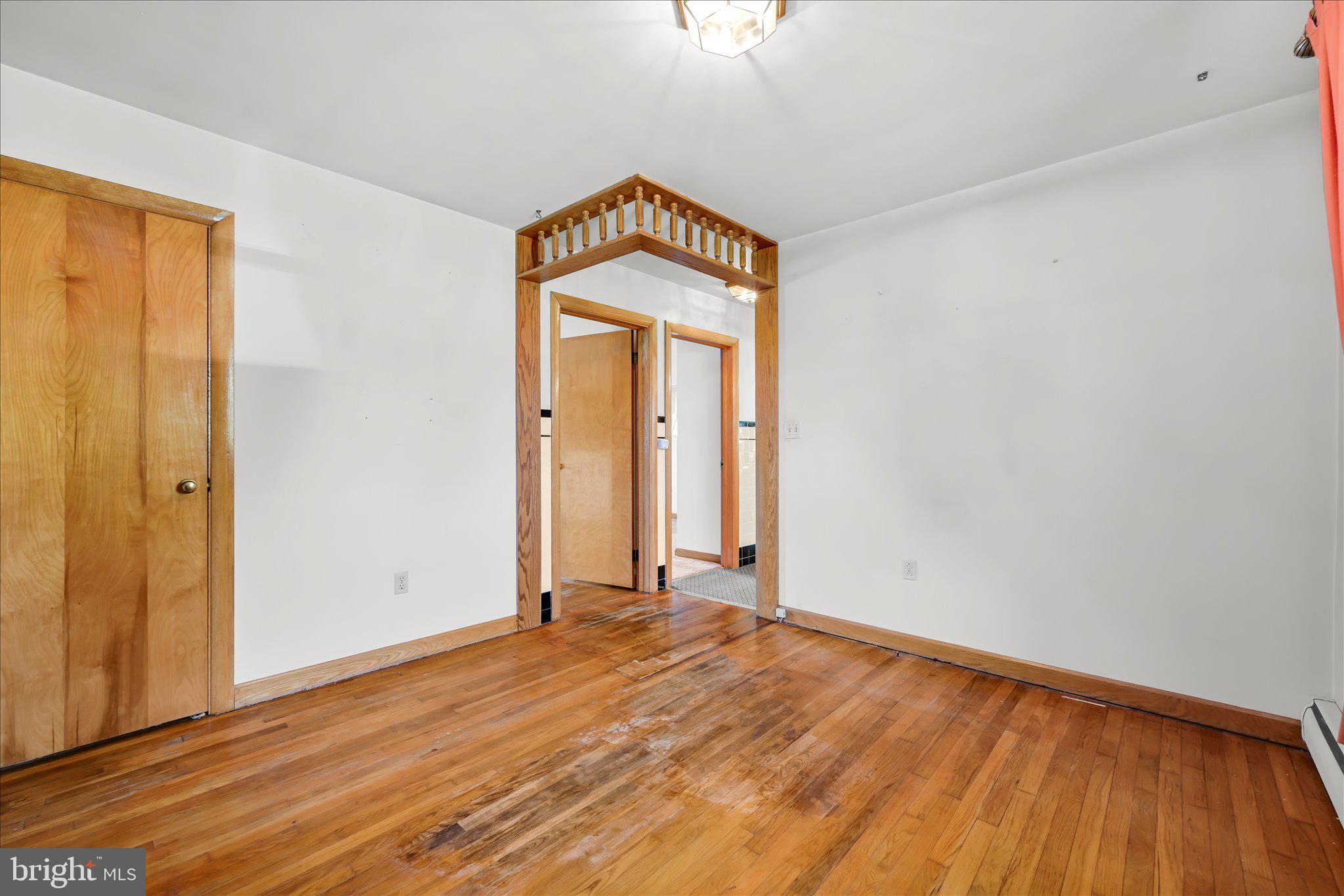 214 West Maple Street Valley View, PA 17983 - Photo 22 of 36 an empty room with a window and wooden floor