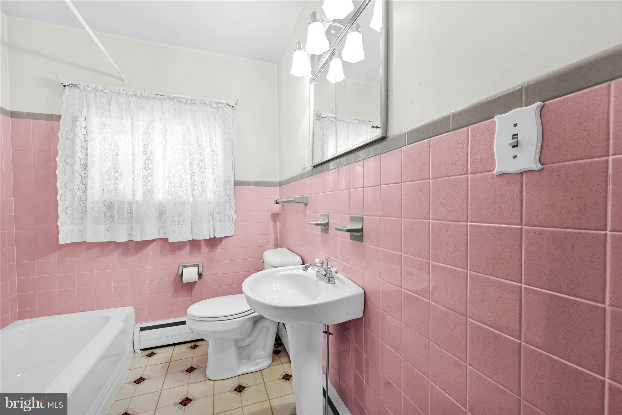 214 West Maple Street Valley View, PA 17983 - Photo 24 of 36 a bathroom with a sink a mirror and a toilet