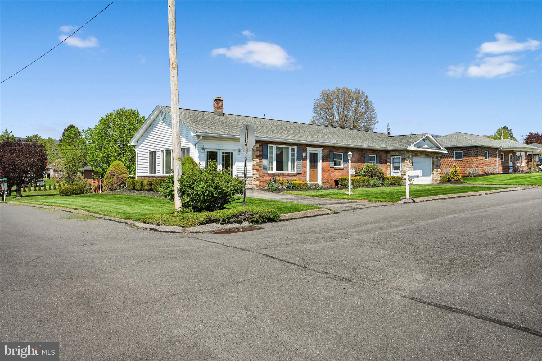 214 West Maple Street Valley View, PA 17983 - Photo 28 of 36 a front view of a house with a yard and potted plants