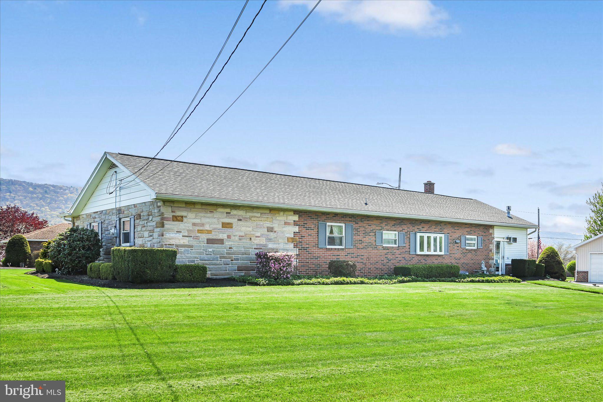 214 West Maple Street Valley View, PA 17983 - Photo 33 of 36 a front view of a house with a garden