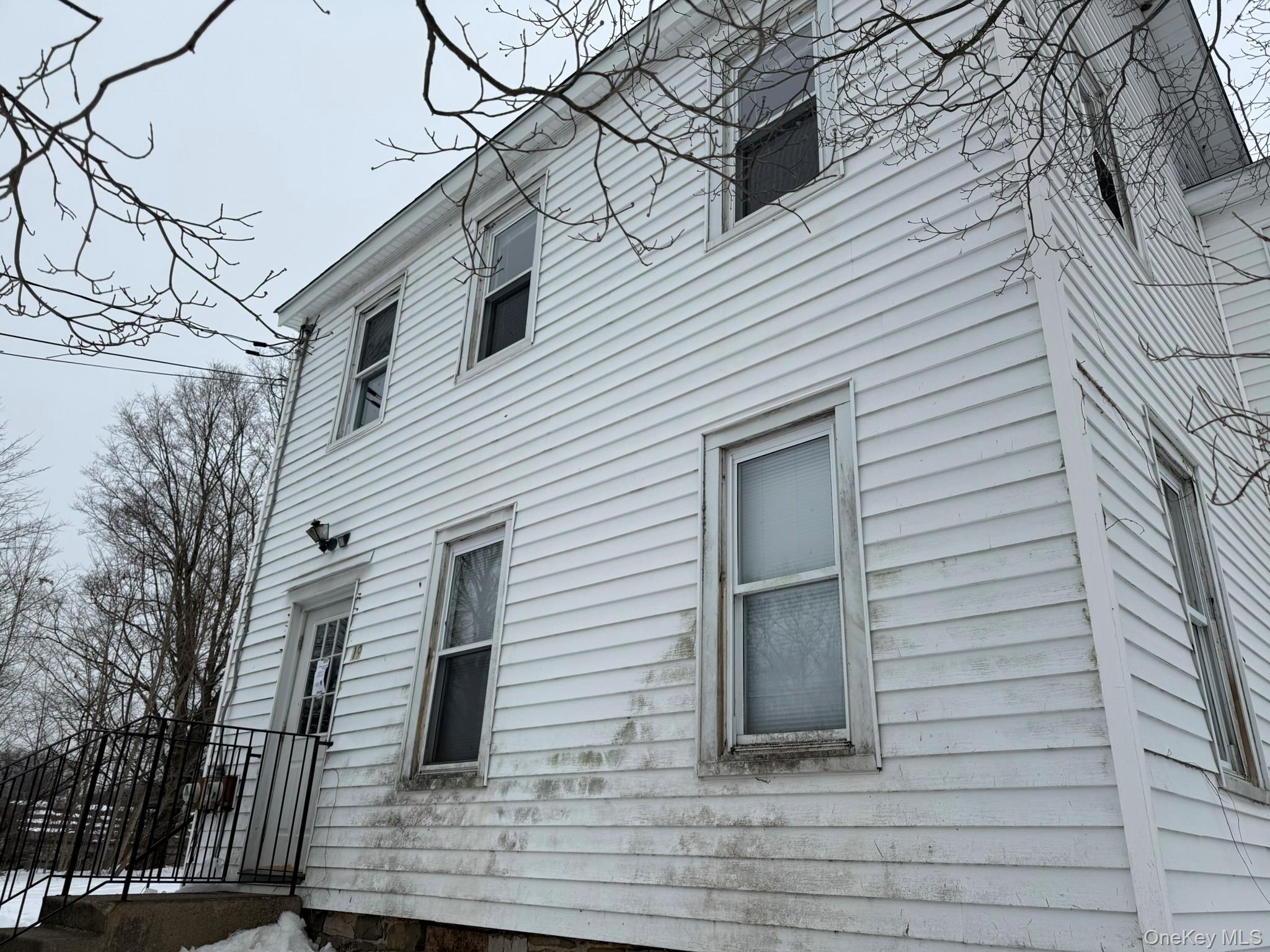 19 Bloomingburg Road Middletown, NY 10940 - Photo 20 of 20 a view of a white house with a large windows