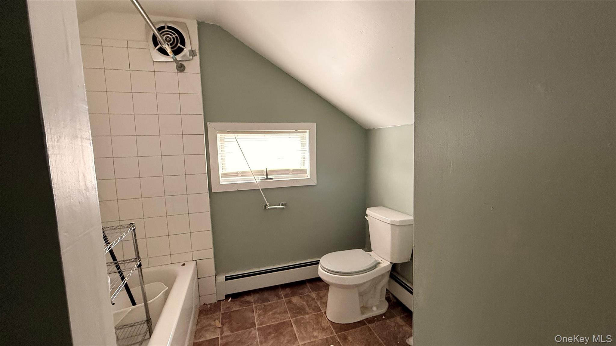 19 Bloomingburg Road Middletown, NY 10940 - Photo 3 of 20 a white toilet sitting next to a bathroom sink