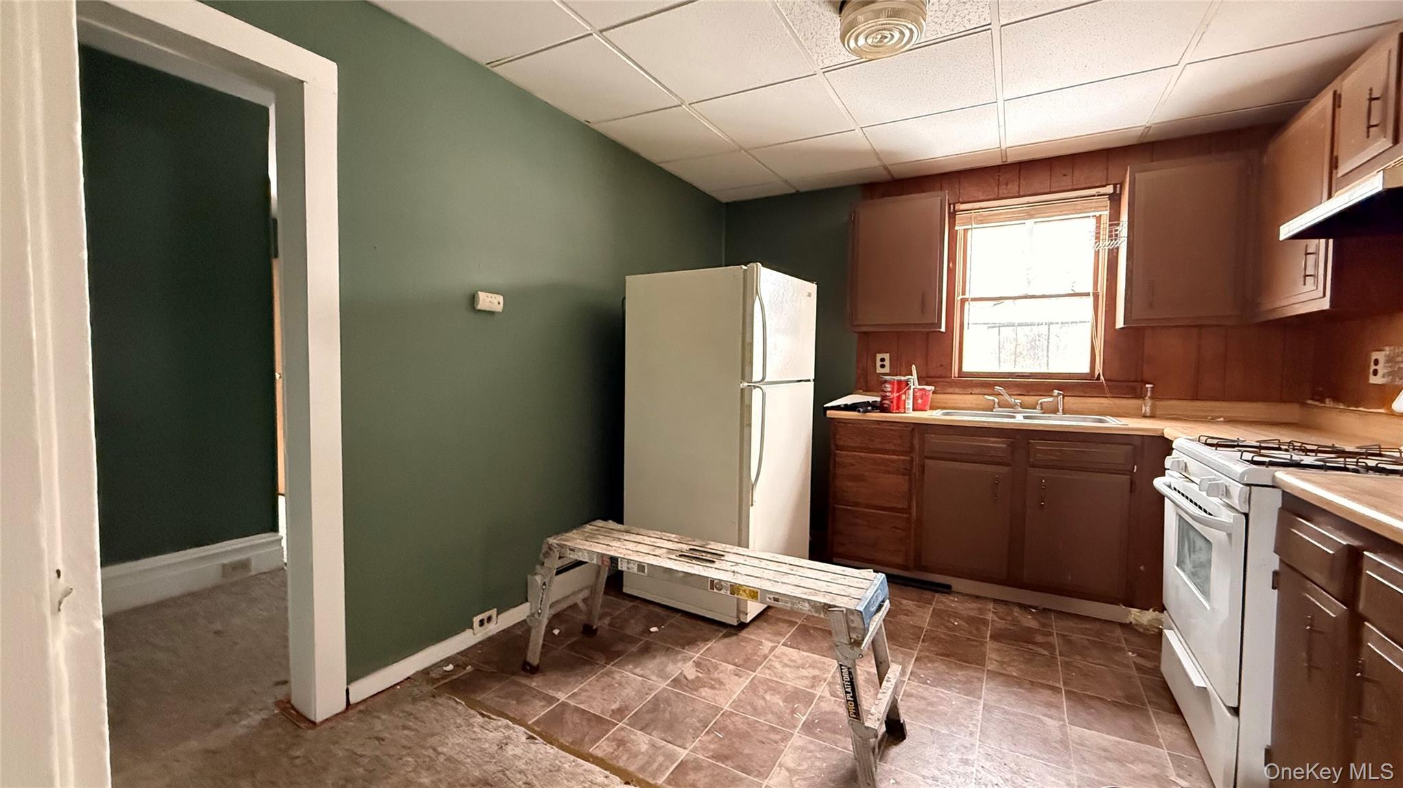 19 Bloomingburg Road Middletown, NY 10940 - Photo 6 of 20 a kitchen with a refrigerator and a stove top oven
