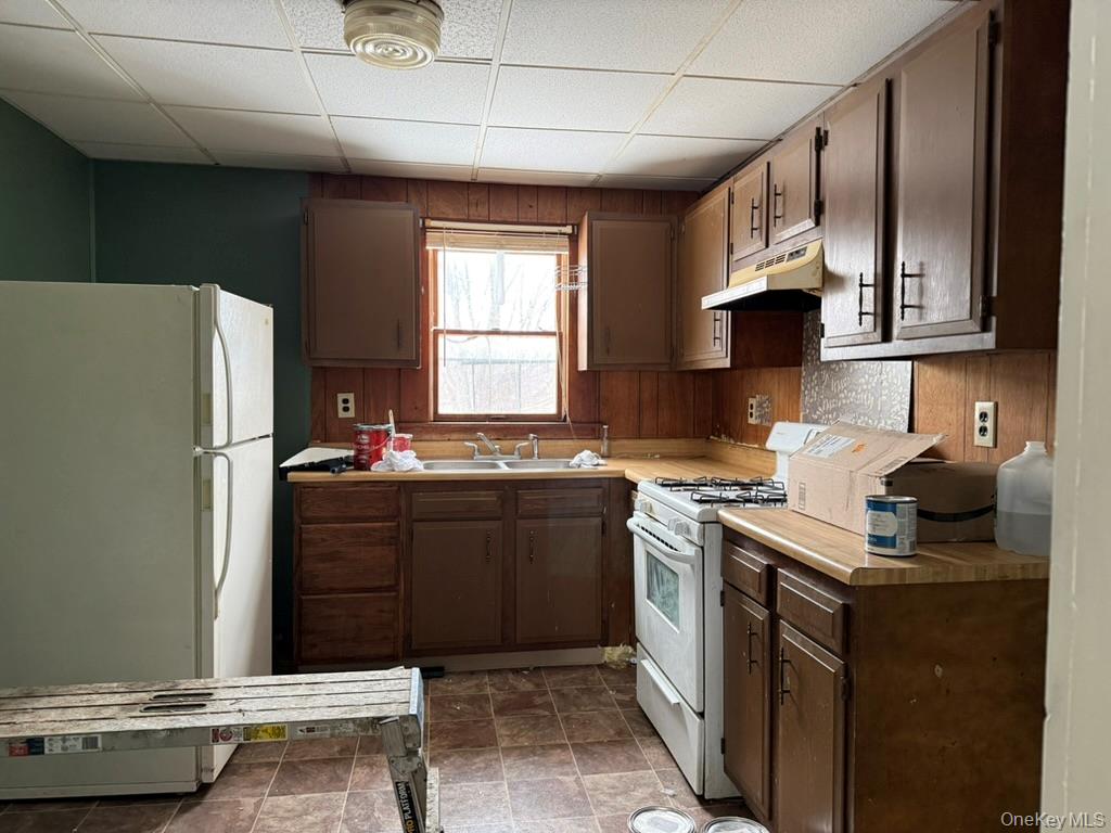 19 Bloomingburg Road Middletown, NY 10940 - Photo 7 of 20 a kitchen with kitchen island granite countertop a sink stove and refrigerator