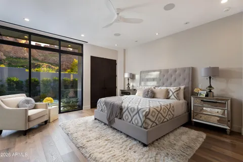 a bedroom with a bed and a couch