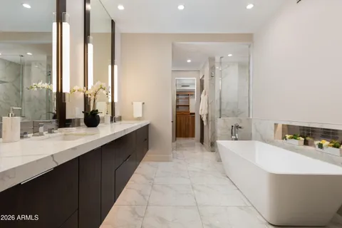 a bathroom with a double vanity sink mirror and double