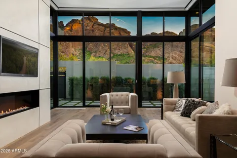 a living room with furniture tv and a fireplace