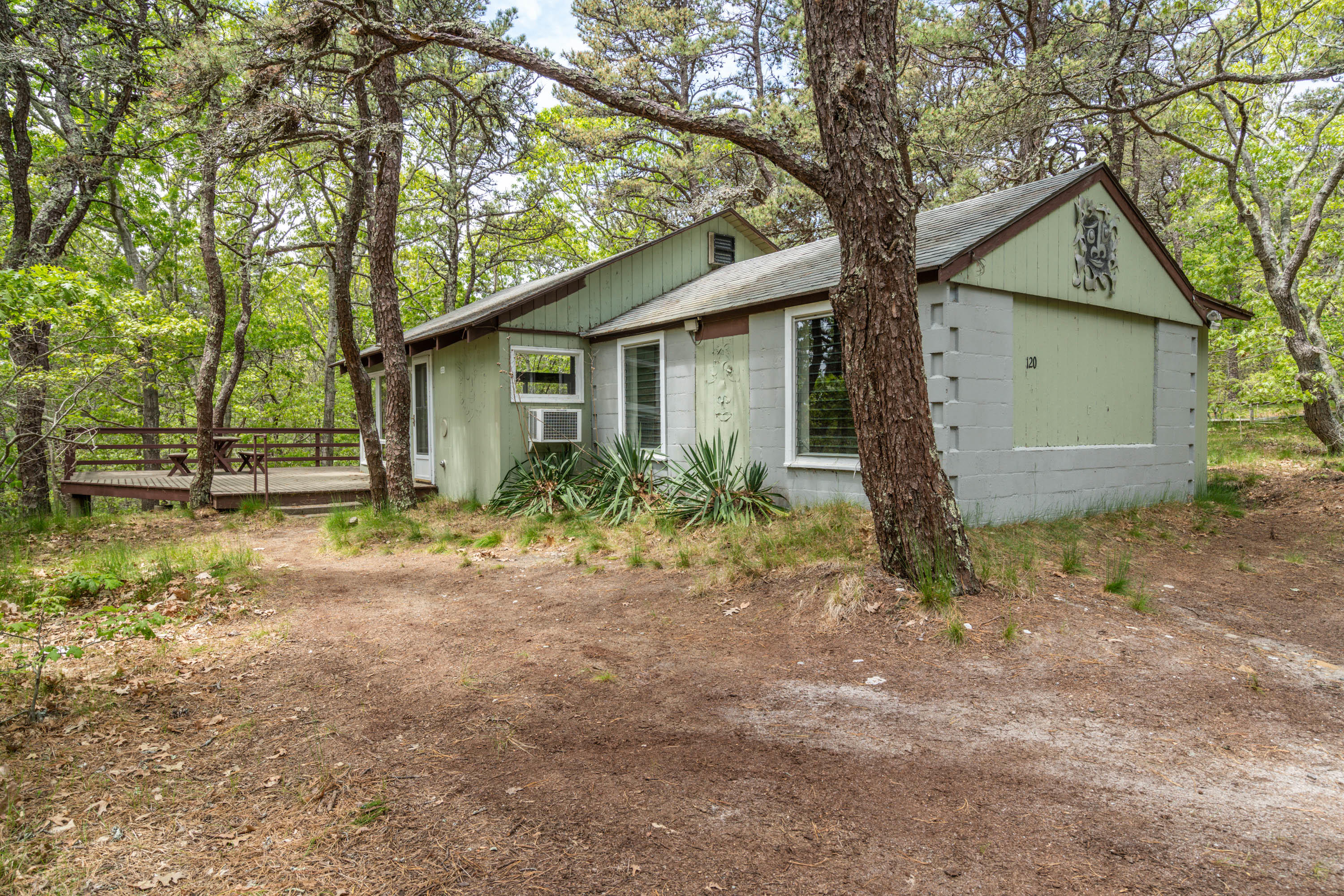 120 Aunt Sally's Road Wellfleet, MA 02667 - Photo 12 of 26 a small white house with a outdoor space