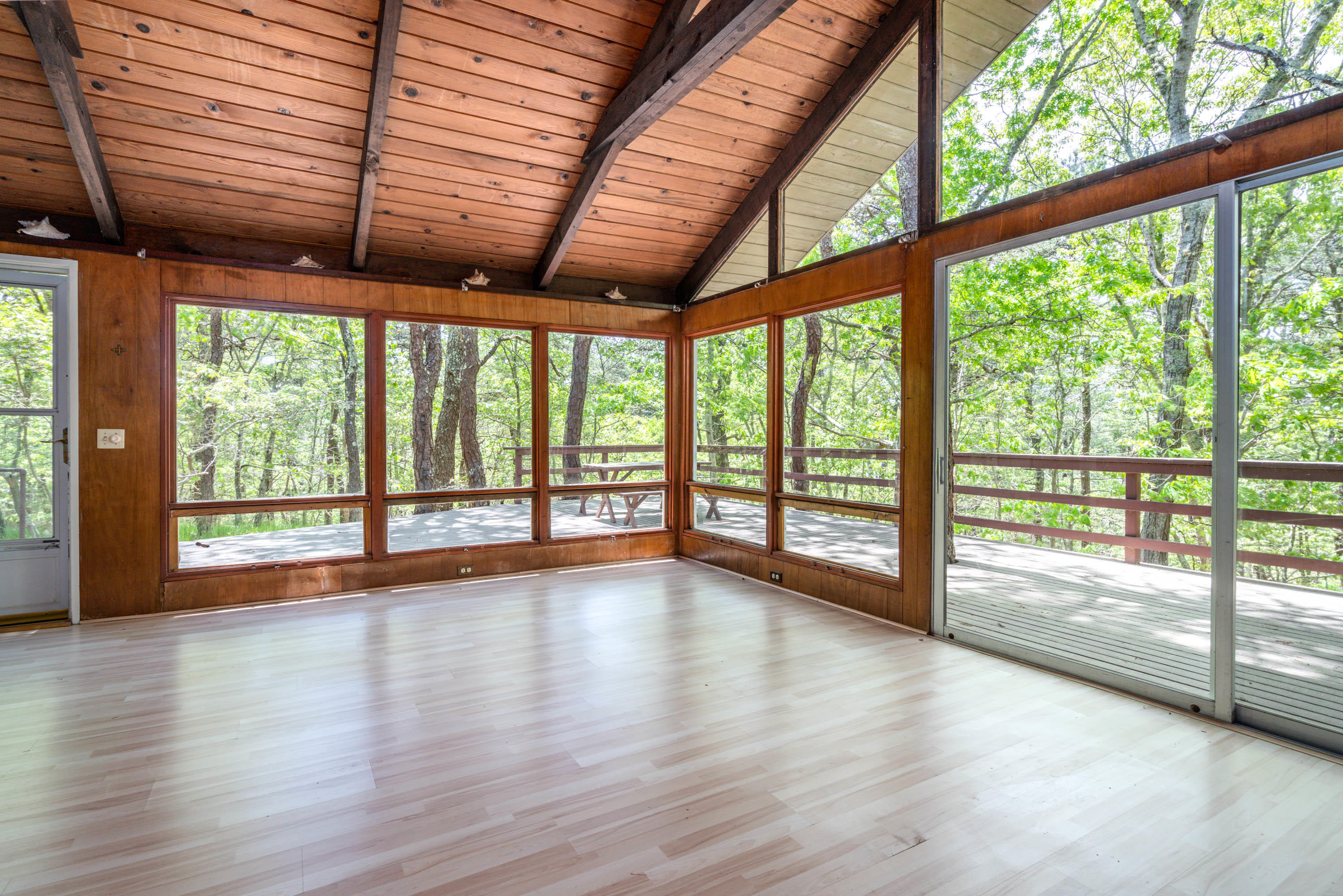 120 Aunt Sally's Road Wellfleet, MA 02667 - Photo 17 of 26 a view of empty room with wooden floor and floor to ceiling window