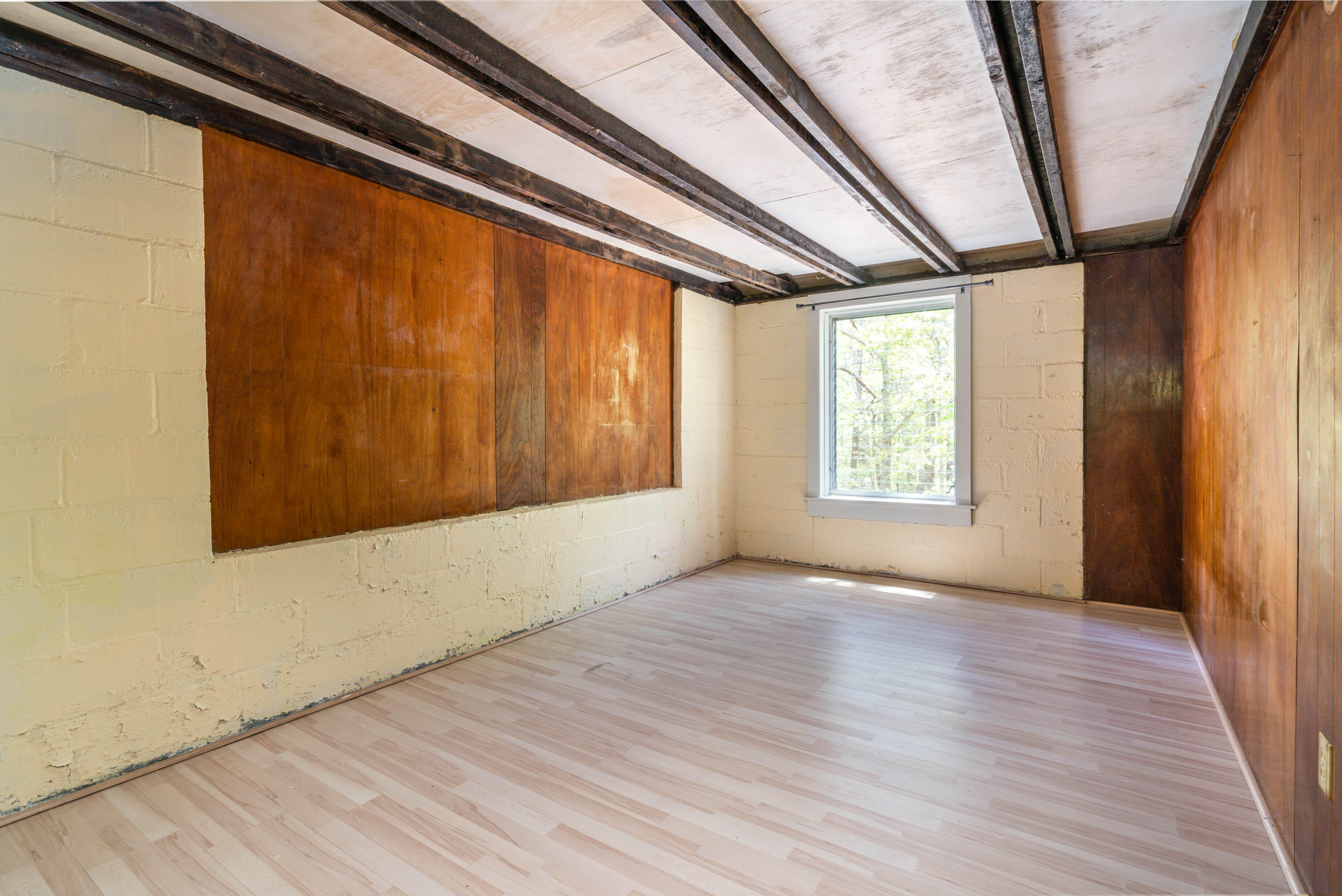 120 Aunt Sally's Road Wellfleet, MA 02667 - Photo 24 of 26 a view of an empty room with wooden floor and a window