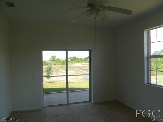 2514 23rd Street Southwest Lehigh Acres, FL 33976 - Photo 11 of 16 an empty room with a window