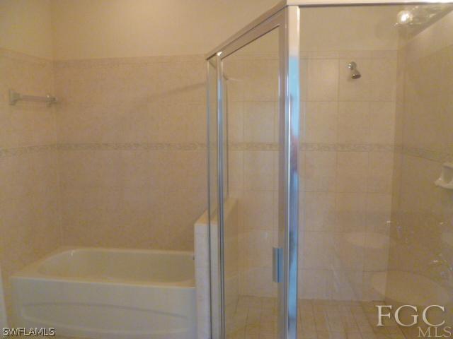 2514 23rd Street Southwest Lehigh Acres, FL 33976 - Photo 16 of 16 a bathroom with a bathtub