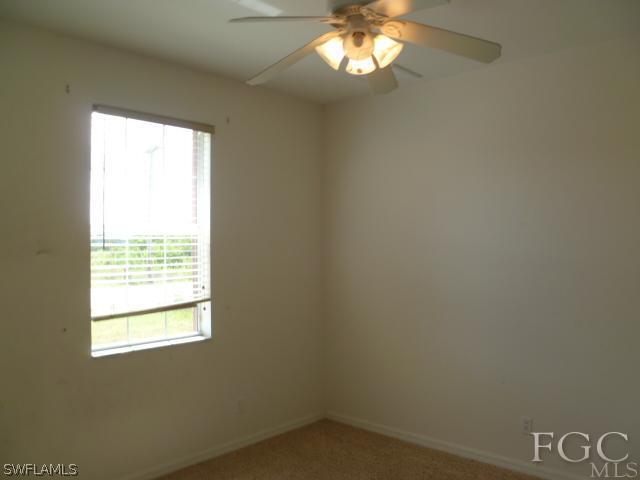 2514 23rd Street Southwest Lehigh Acres, FL 33976 - Photo 3 of 16 a view of an empty room with a window