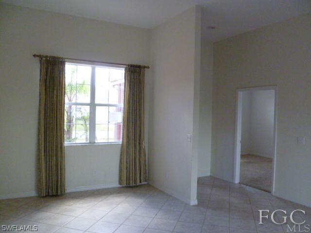 2514 23rd Street Southwest Lehigh Acres, FL 33976 - Photo 5 of 16 a view of an empty room with a window