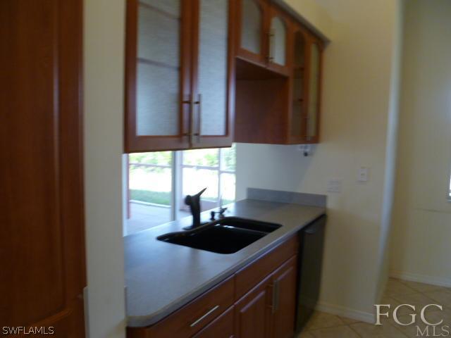2514 23rd Street Southwest Lehigh Acres, FL 33976 - Photo 8 of 16 a kitchen with a sink and a window