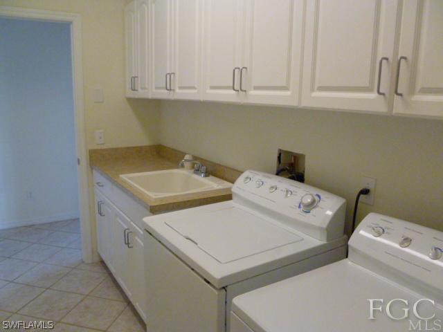 2514 23rd Street Southwest Lehigh Acres, FL 33976 - Photo 9 of 16 a utility room with dryer and washer