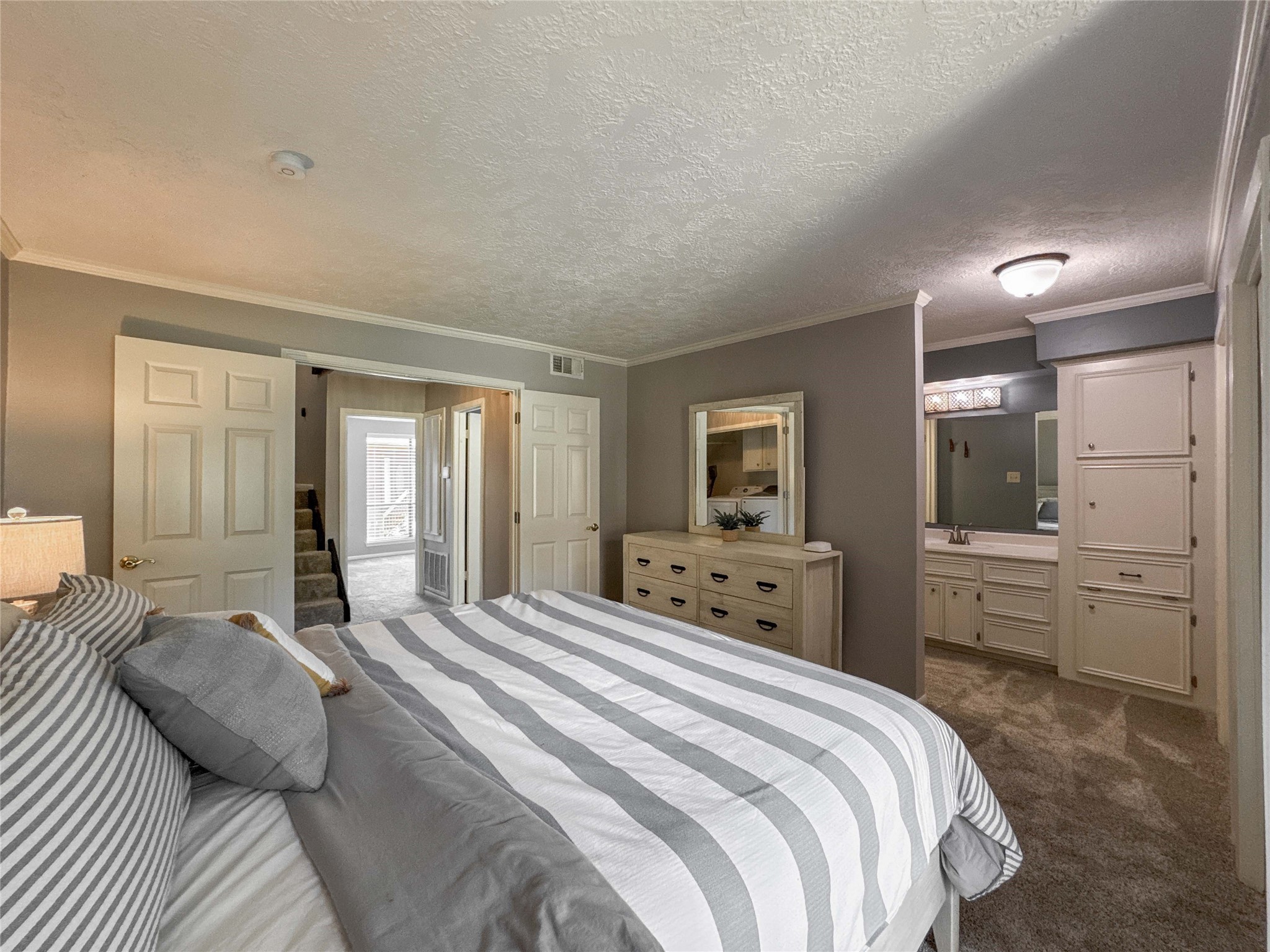 727 Davis Road League City, TX 77573 - Photo 18 of 28 a bedroom with a large bed and a couch