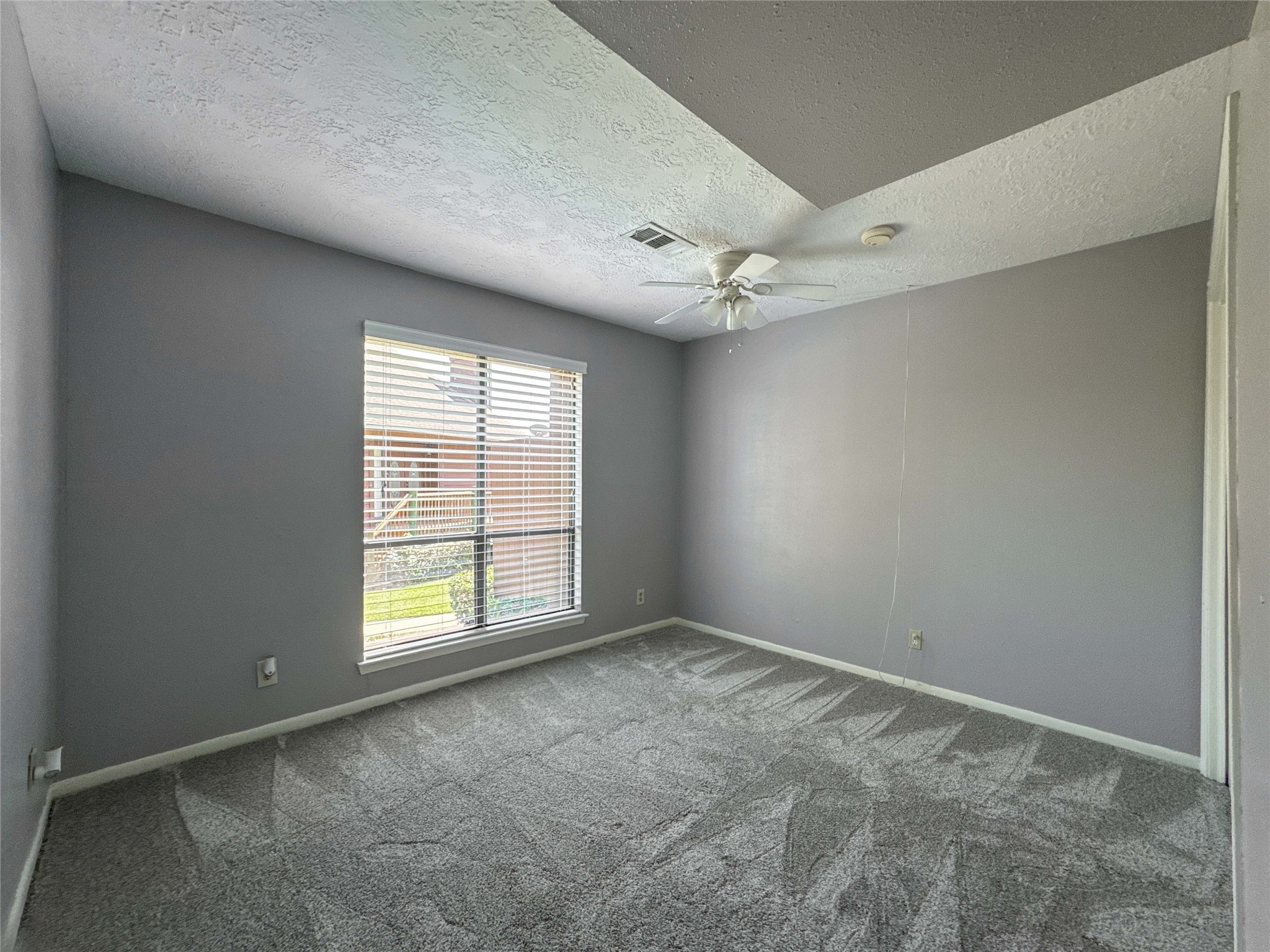 727 Davis Road League City, TX 77573 - Photo 20 of 28 an empty room with windows and fan