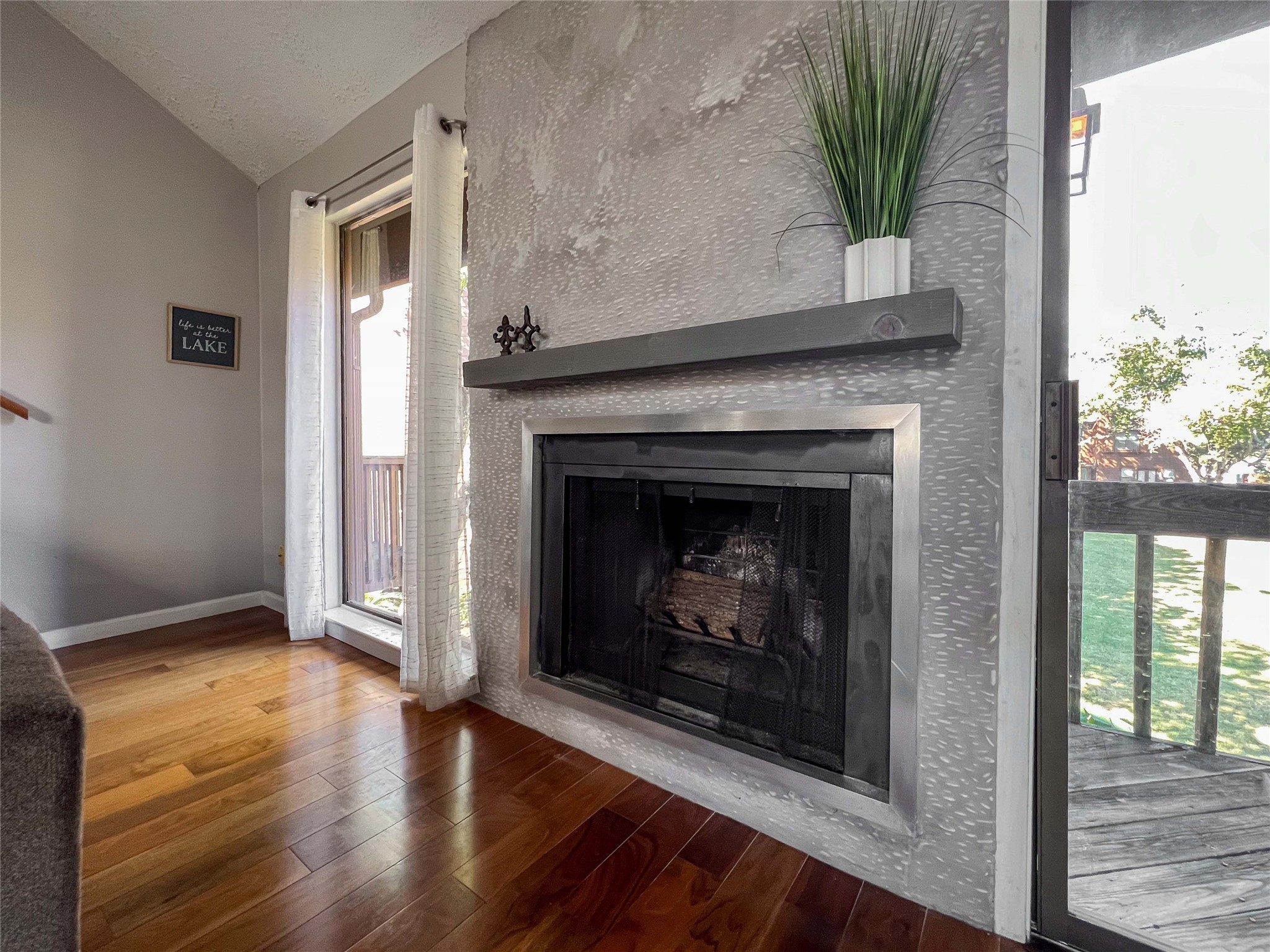 727 Davis Road League City, TX 77573 - Photo 3 of 28 a living room with a fireplace and a potted plant