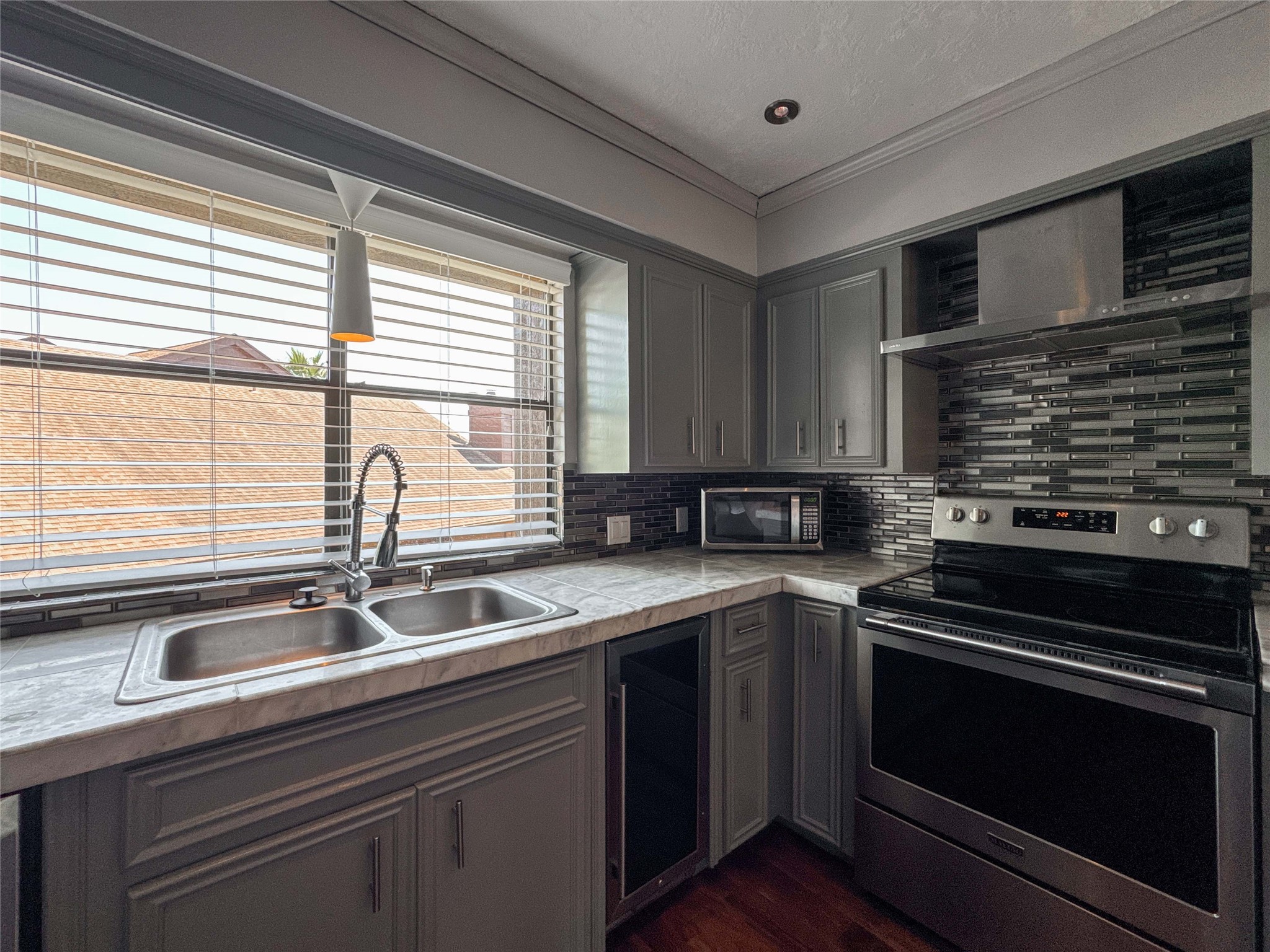 727 Davis Road League City, TX 77573 - Photo 9 of 28 a kitchen with a sink stove and cabinets