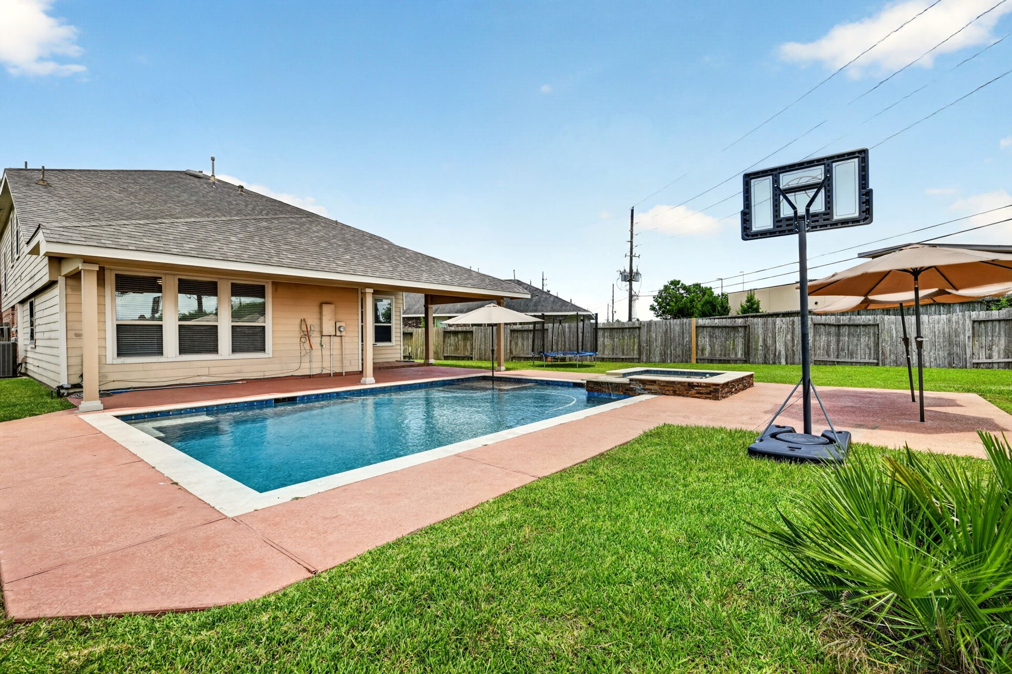 6446 Tea Tree Drive Katy, TX 77494 - Photo 33 of 39 Back Yard Pool Area -
Covered patio is in the background.