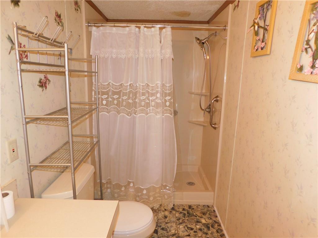 612 Upper Middletown Road Smock, PA 15480 - Photo 15 of 17 a bathroom with a shower curtain and a sink