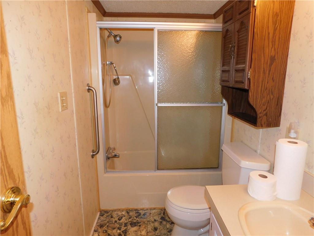 612 Upper Middletown Road Smock, PA 15480 - Photo 17 of 17 a bathroom with a toilet and a shower