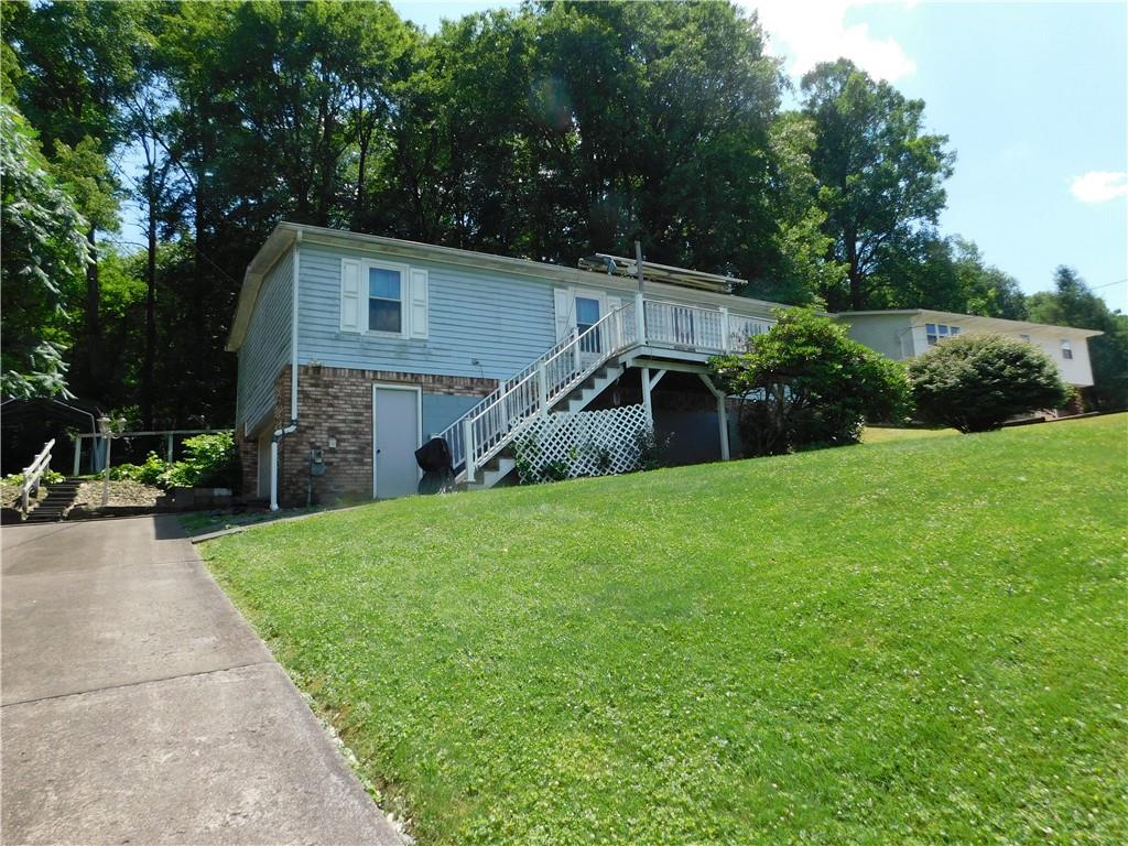 612 Upper Middletown Road Smock, PA 15480 - Photo 2 of 17 a view of a house with backyard and sitting area