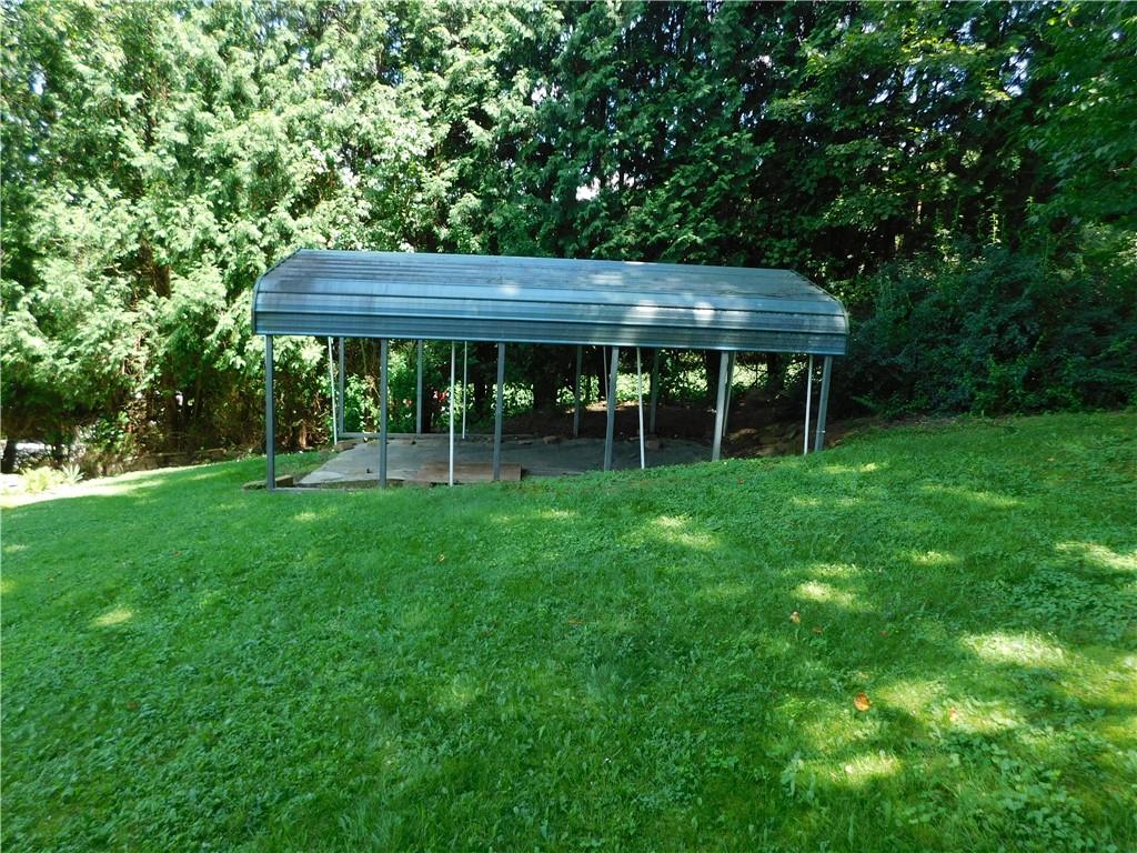 612 Upper Middletown Road Smock, PA 15480 - Photo 4 of 17 a view of a wooden deck and a yard