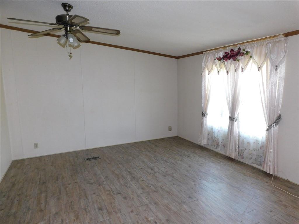 612 Upper Middletown Road Smock, PA 15480 - Photo 5 of 17 a view of a room with window and a ceiling fan