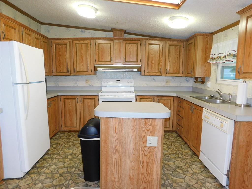 612 Upper Middletown Road Smock, PA 15480 - Photo 7 of 17 a kitchen with stainless steel appliances a refrigerator sink and cabinets