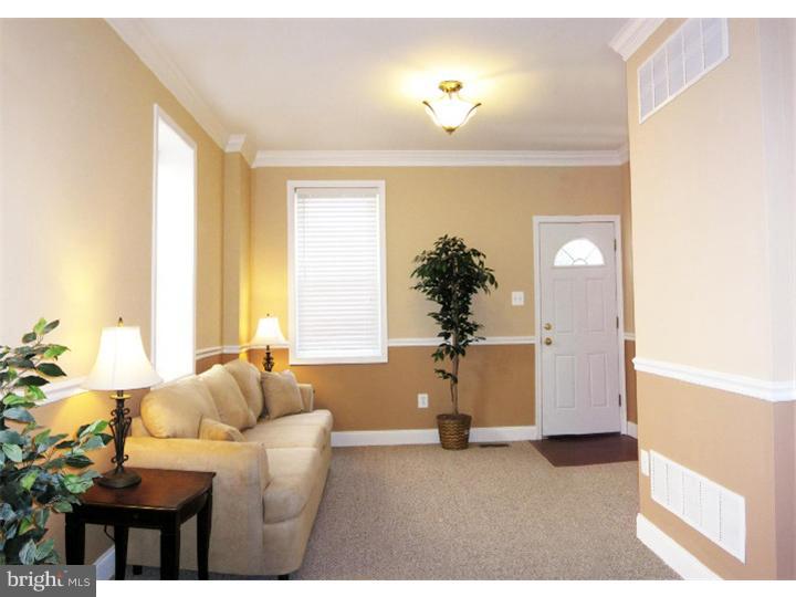 223 Chestnut Street Spring City, PA 19475 - Photo 2 of 11 a living room with furniture and a large window