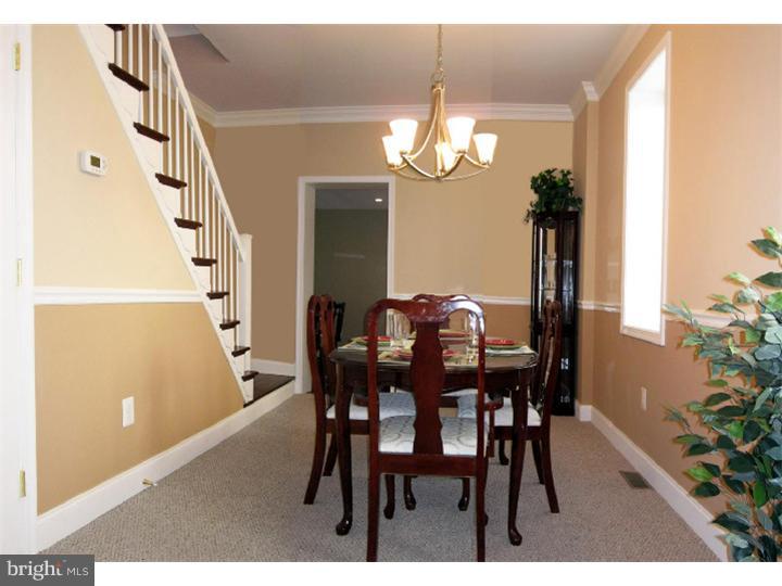 223 Chestnut Street Spring City, PA 19475 - Photo 3 of 11 a view of a dining room with furniture and chandelier
