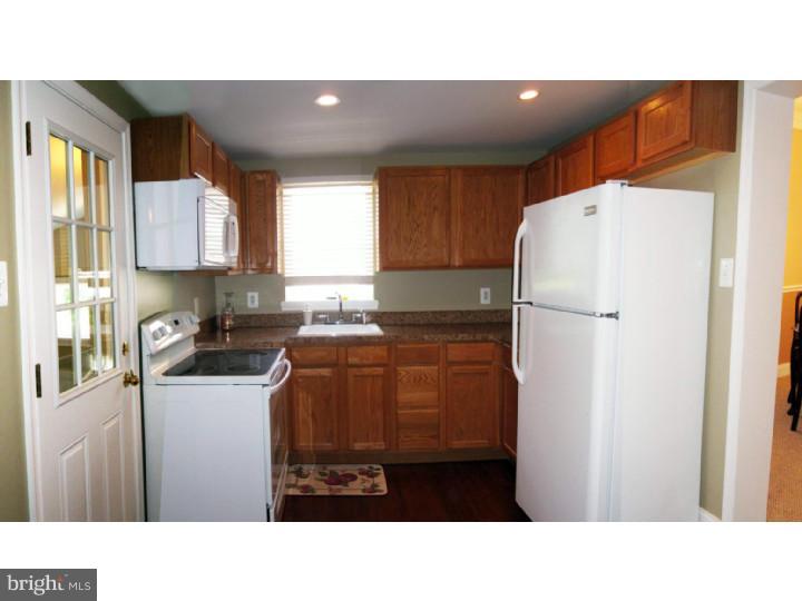 223 Chestnut Street Spring City, PA 19475 - Photo 5 of 11 a kitchen with stainless steel appliances a refrigerator and a sink