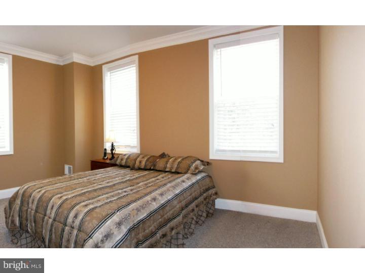 223 Chestnut Street Spring City, PA 19475 - Photo 6 of 11 a bedroom with a bed and a window