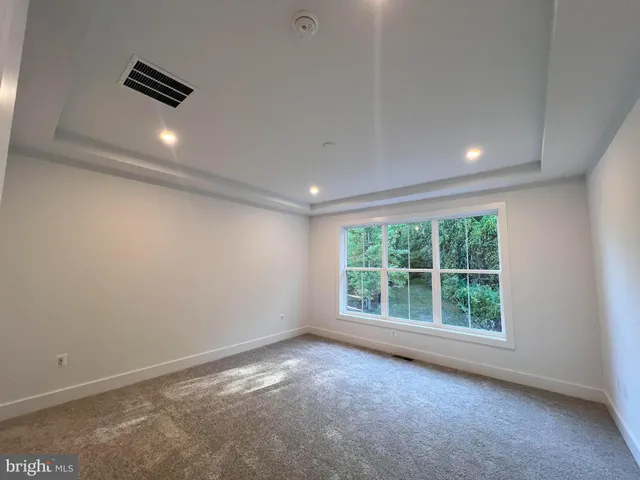 a bathroom with a double vanity sink toilet mirror and bathtub