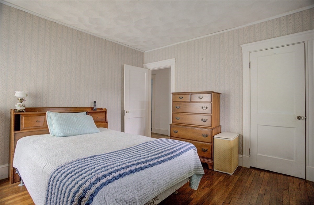 44 Cottage Park Road Winthrop, MA 02152 - Photo 17 of 39 a bedroom with a bed and a dresser