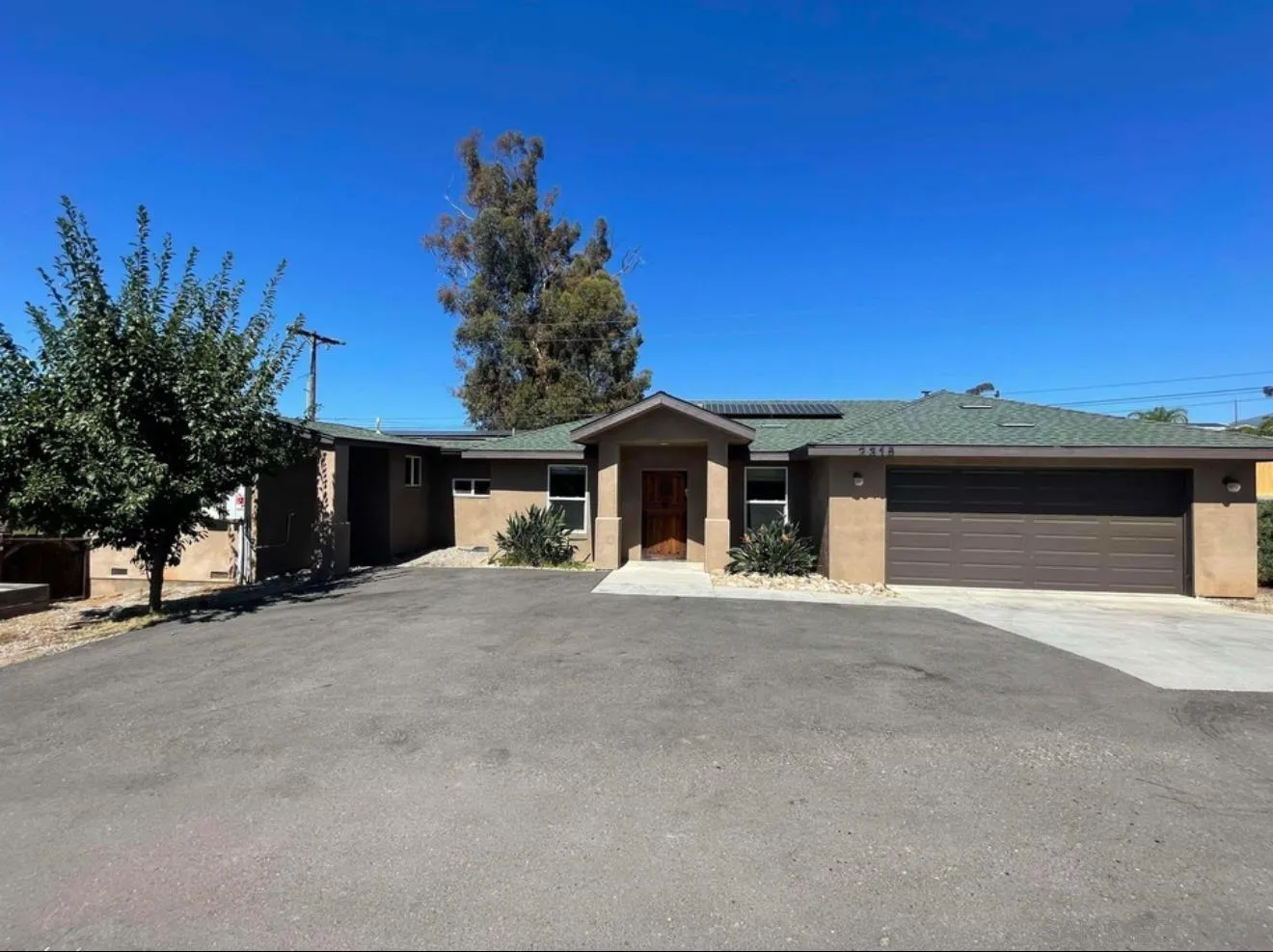 2315 Tavern Road Alpine, CA 91901 - Photo 1 of 1 a front view of a house with a yard and garage