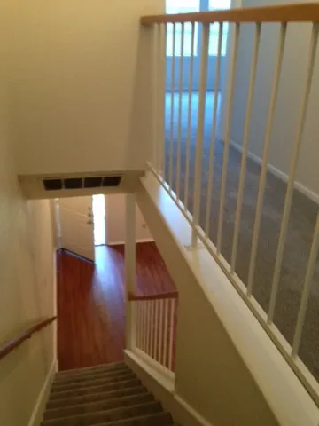 a view of balcony with wooden floor