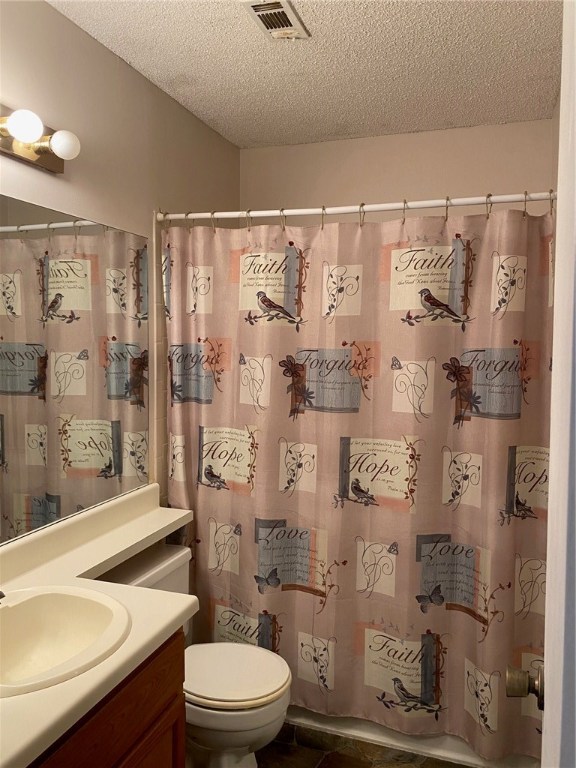 11821 Bittern Hollow, Unit 20 Austin, TX 78758 - Photo 13 of 14 a bathroom with a granite countertop sink toilet and shower