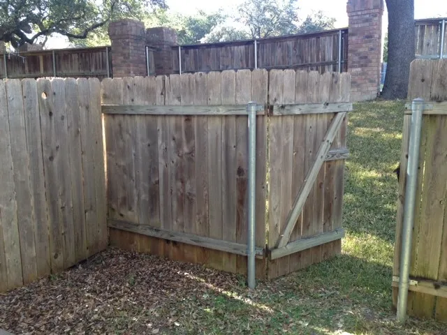 a view of outdoor space with wooden fence