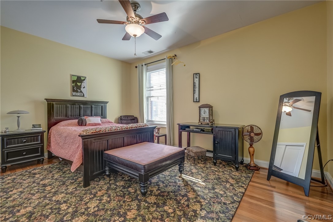 116 Cedar Works Row Richmond, VA 23231 - Photo 14 of 21 a bedroom with a bed and wooden floor