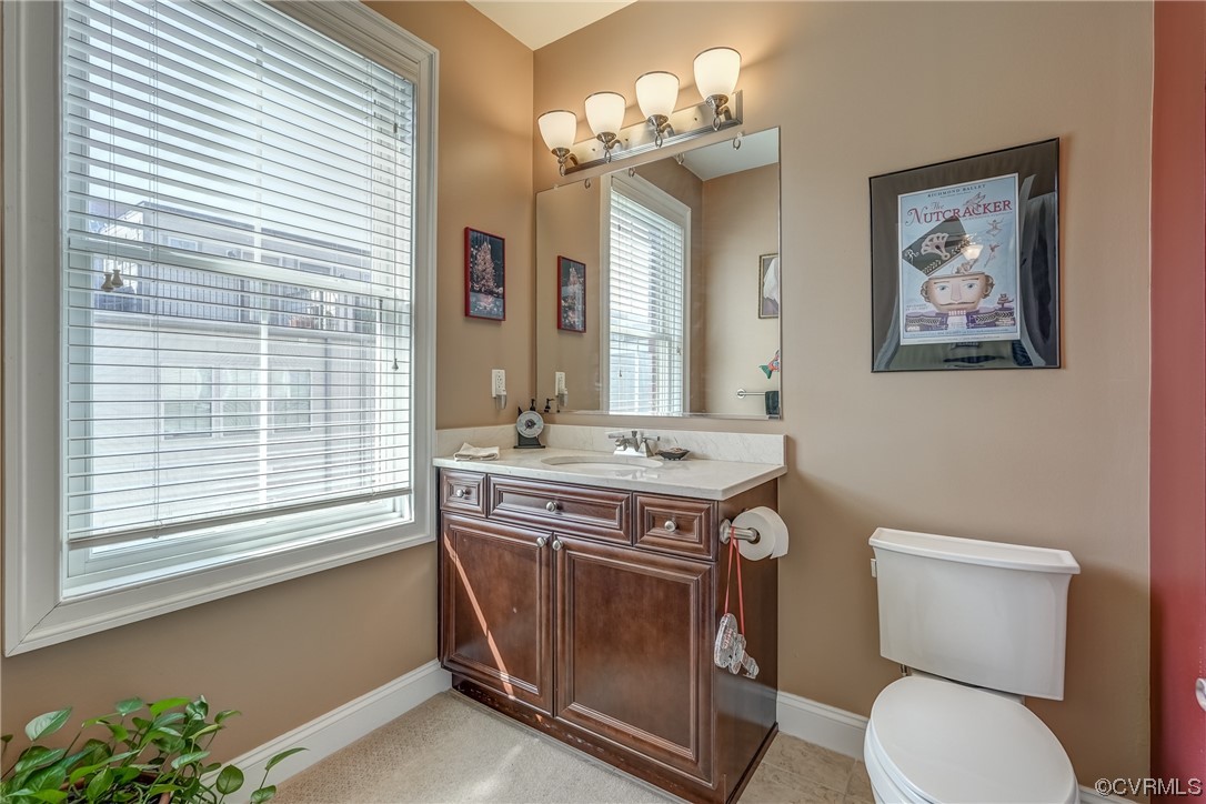 116 Cedar Works Row Richmond, VA 23231 - Photo 15 of 21 a bathroom with a toilet a sink and a mirror
