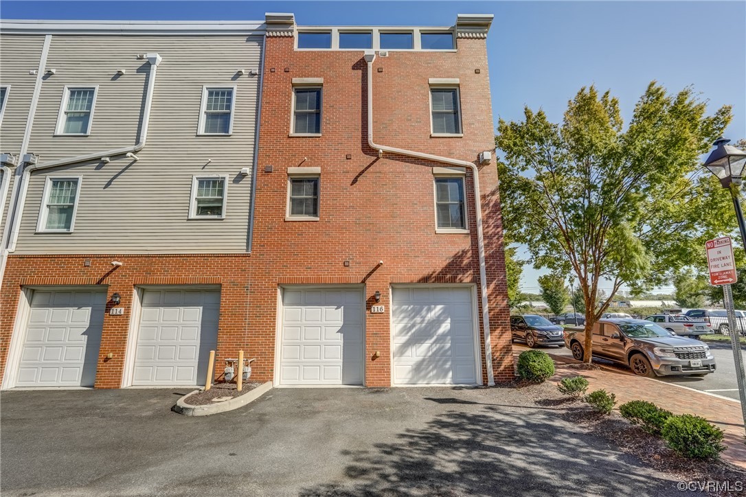 116 Cedar Works Row Richmond, VA 23231 - Photo 18 of 21 a front view of a building with parking